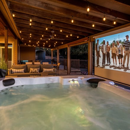 Mountain Elegance hot tub with outdoor projector screen